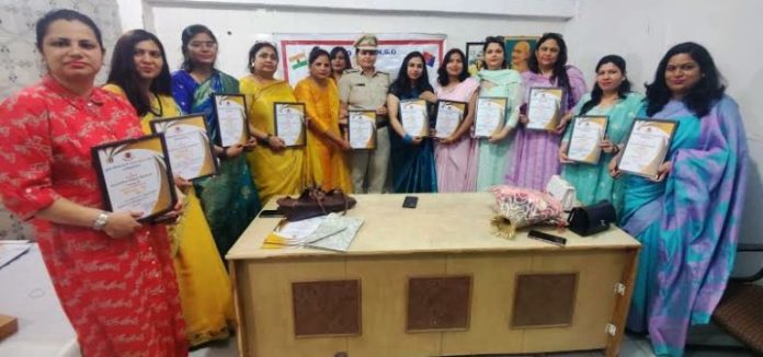 International Women's Day Human Legal Aid and Crime Control Organization honored women police officers and educationists
